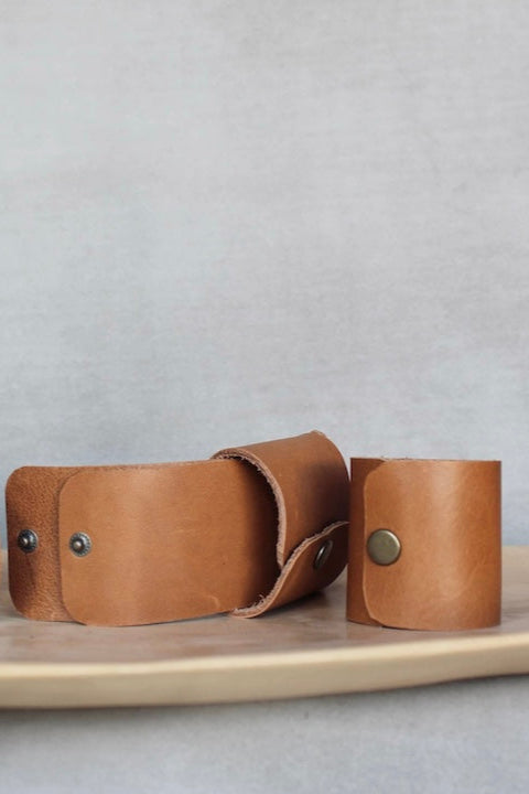 photo of tan leather napkin ring