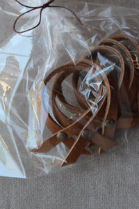 photo of the thin leather napkin rings