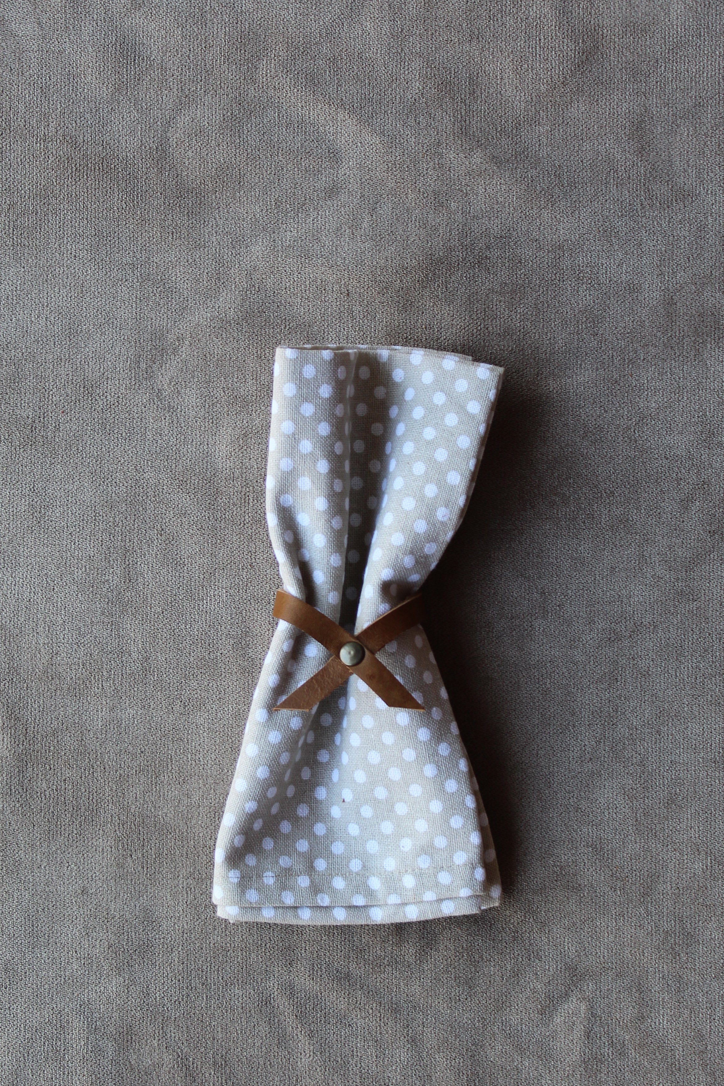 photo of the thin leather napkin ring