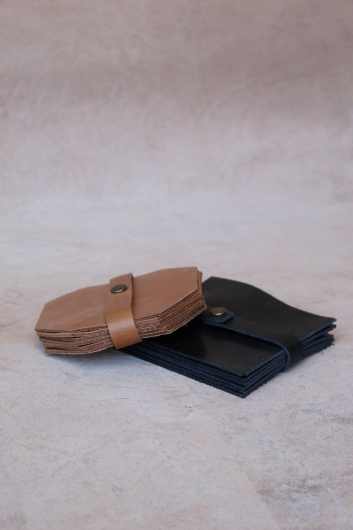 Leather coasters in tan and black