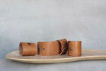 Load image into Gallery viewer, photo of tan leather napkin ring
